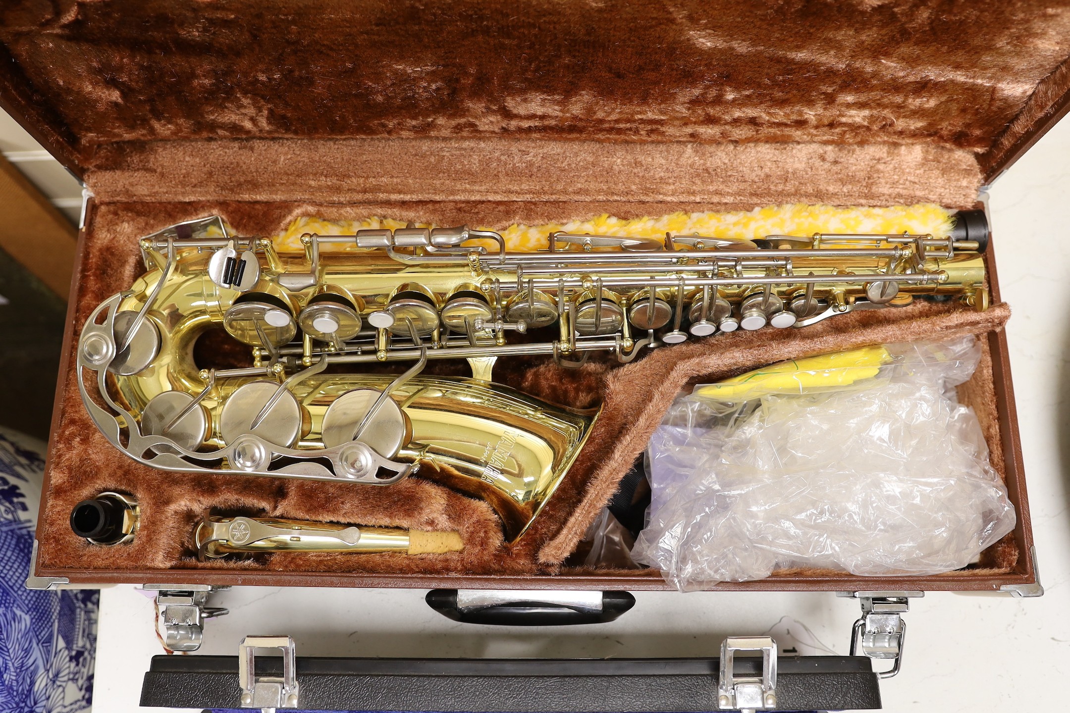 A Yamaha saxophone and a cased Arbiter flute (2)
